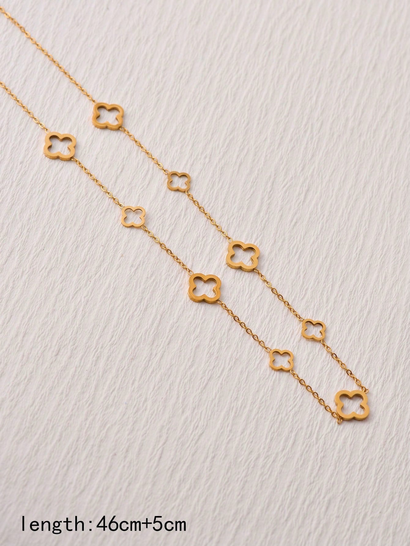 A Fashionable Titanium Steel 18K Gold Nine Hollow Lucky Four-Leaf Clover Necklace Suitable for Daily Wear by Women